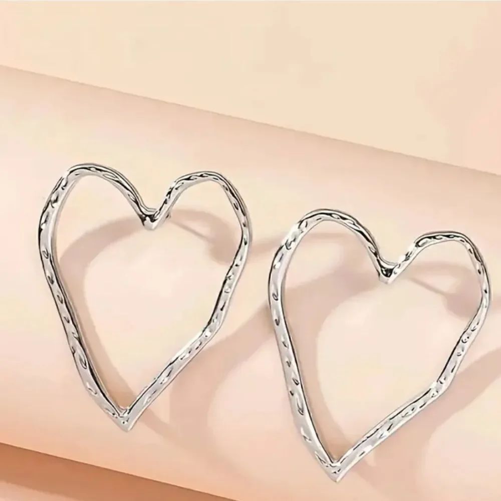 Heart silvertone stud earrings